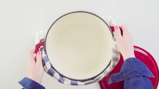 Brand new enameled cast iron covered dutch oven on a white background. - 写真・画像