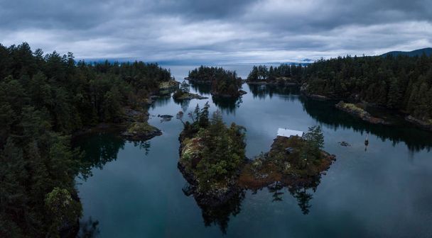 Aerial drone panoramic landscape view of Smuggler Cove during a cloudy and rainy sunset. Taken in Sunshine Coast, British Columbia, Canada. - Fotoğraf, Görsel