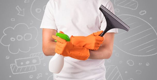 Male housekeeper with grey doodled wallpaper - Zdjęcie, obraz