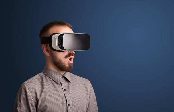Businessman with virtual reality goggles - Photo, image