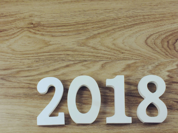number wooden new year on wooden background - Φωτογραφία, εικόνα