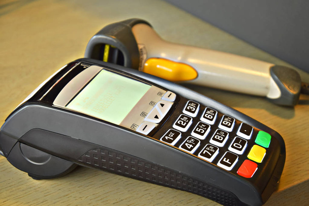 Bank terminal with hand reader of barcode - Photo, Image