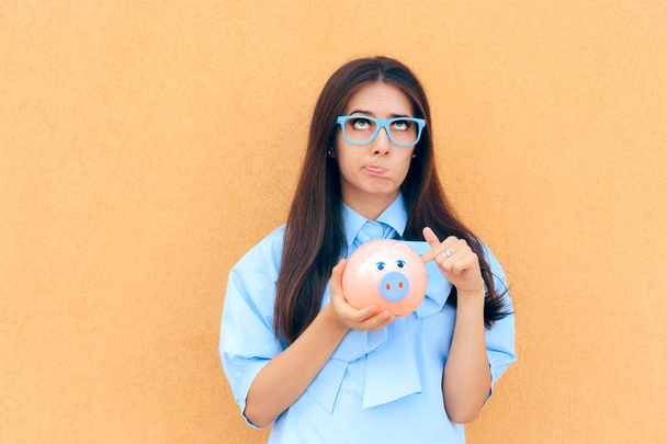 Worried Woman with Piggy Bank thinking what to Invest in - Fotoğraf, Görsel