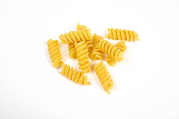 uncooked fusilli pasta noodles isolated on white background - Photo, Image