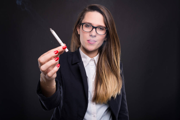 Relaxed businesswoman sharing a cigare with you - Foto, Imagen