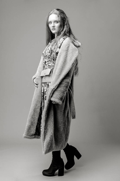 Attractive young fashion model posing on studio background  - Foto, immagini