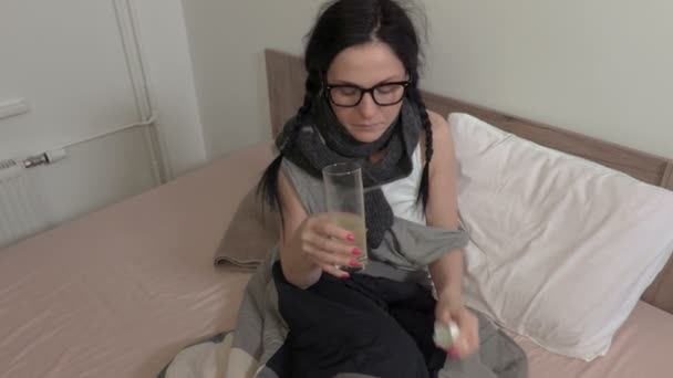 Sick woman in bed take medicine - Кадры, видео