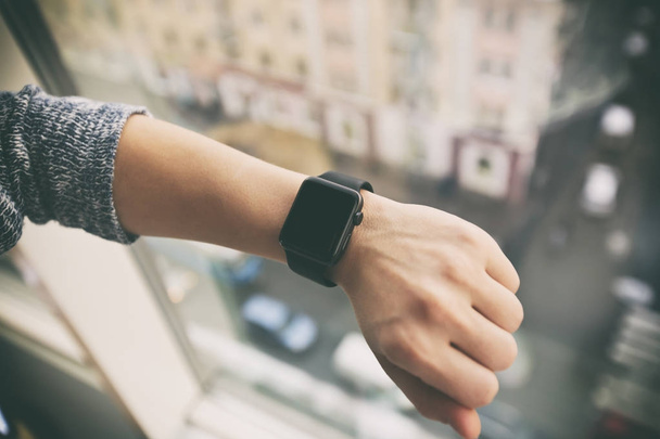 The modern smart watch on the woman's hand - Photo, Image