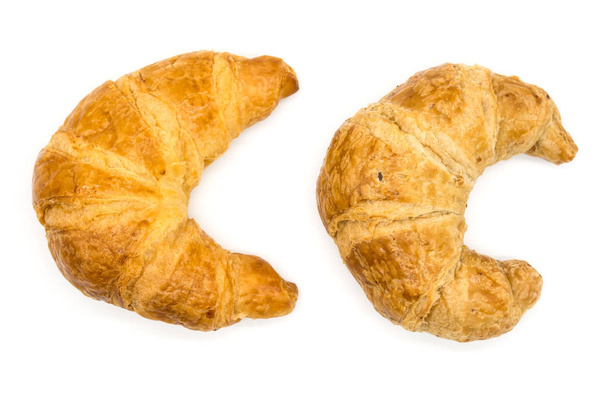 Fresh two croissant isolated on a white background closeup . - Photo, Image