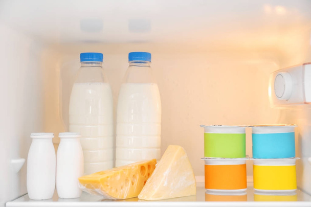 Dairy products on refrigerator shelf - Fotoğraf, Görsel