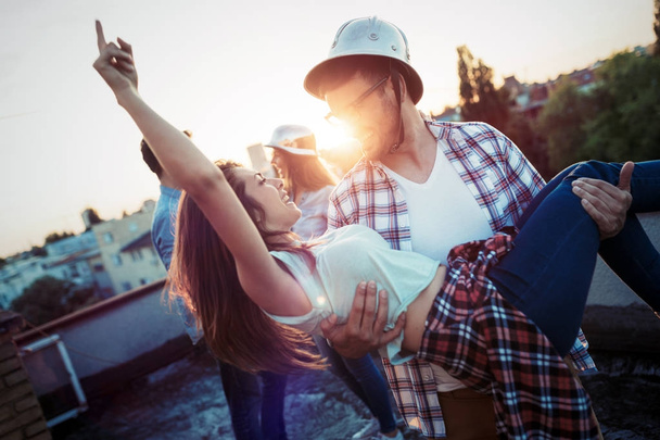 Couple flirting while having a drink on rooftop terrasse - Φωτογραφία, εικόνα