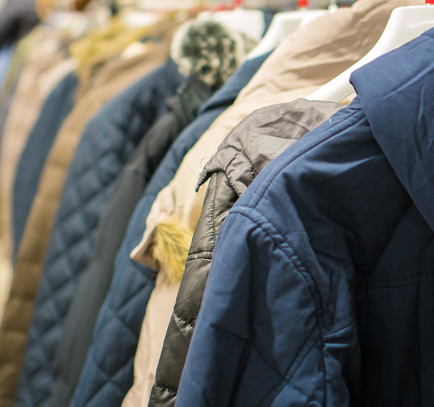 Collection of winter jackets in clothing store. - Photo, Image