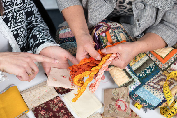  seamstress and her apprentice with fabric for patchwork - Photo, image