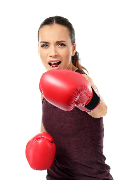Strong woman in boxing gloves on white background - Photo, Image