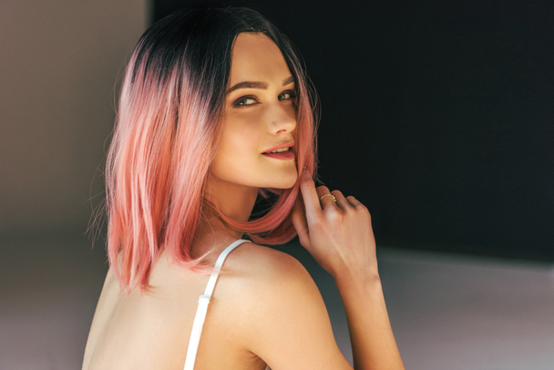 beautiful smiling girl with pink hair posing for fashion shoot - Фото, зображення
