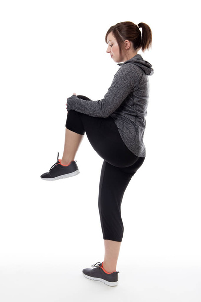 fitness nainen ampui sudio venyttely jalka
 - Valokuva, kuva