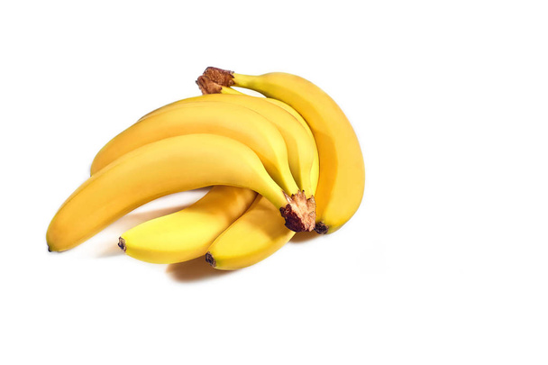 Ripe yellow bananas on a white background - Фото, зображення
