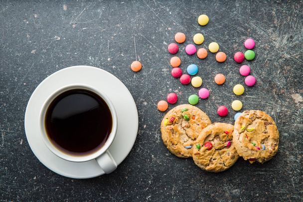 Sweet cookies with colorful candies and coffee mug. - Foto, immagini