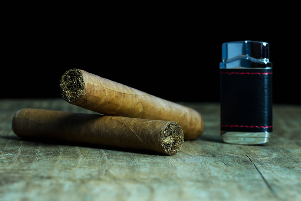 Two Cuban cigars with a lighter - Photo, Image