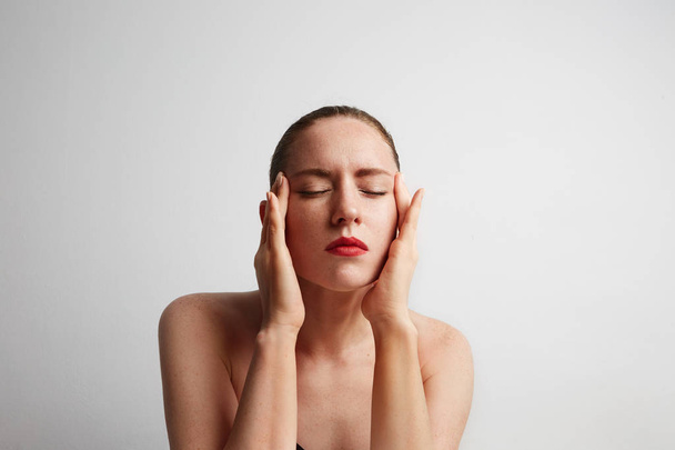 Health, spa and beauty concept - clean face of beautiful young woman with closed eyes - Fotografie, Obrázek