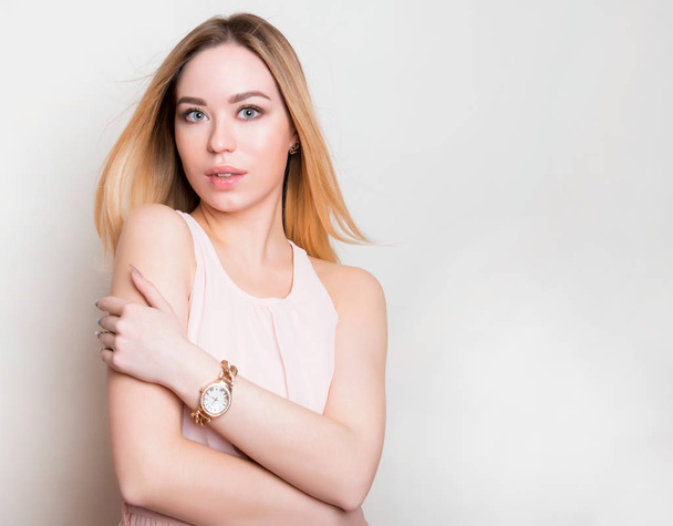 Beautiful young woman with wrist watch - Valokuva, kuva