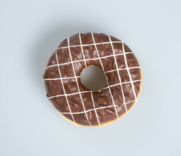 donut or chocolate donut on a background. - Фото, изображение