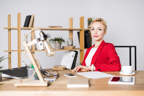 portrait of beautiful businesswoman at workplace in office - Photo, Image