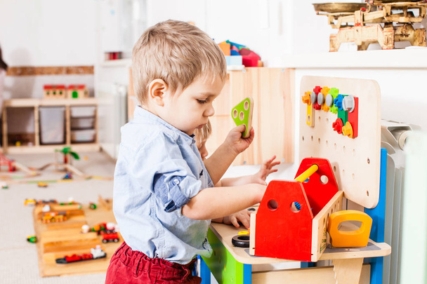 Boys play with wooden toys - Photo, Image