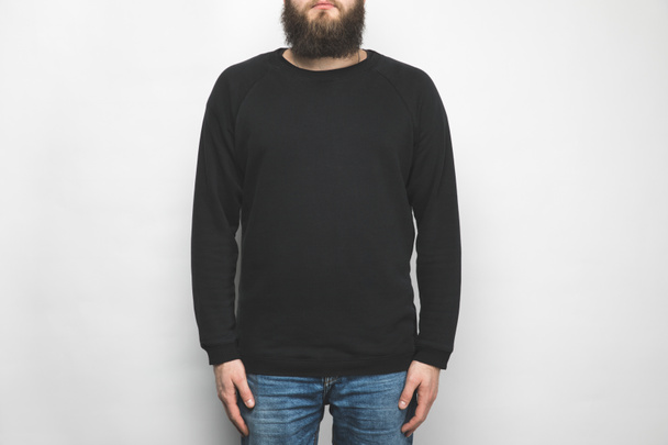 cropped shot of man in black sweatshirt isolated on white - Foto, Imagen
