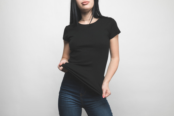 stylish young woman in blank black t-shirt on white - Photo, Image