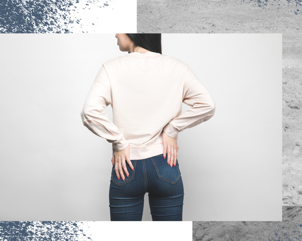 rear view of stylish woman in blank sweatshirt shirt on white with creative frame - Photo, Image