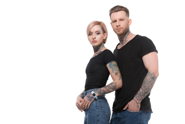 stylish tattooed couple posing together, isolated on white   - Foto, afbeelding