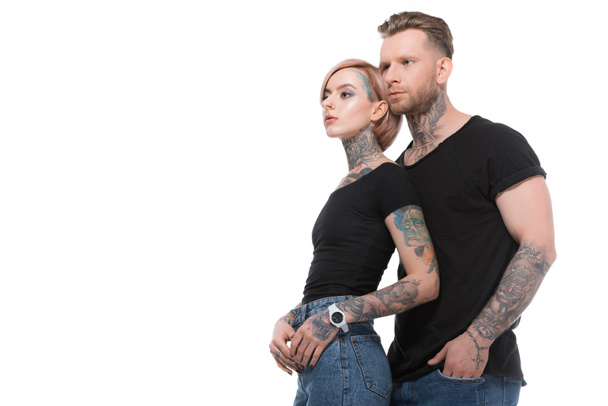 pareja tatuada de moda posando juntos, aislados en blanco
   - Foto, Imagen