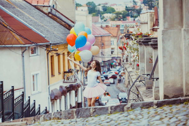 Girl with colorful latex balloons - Foto, imagen