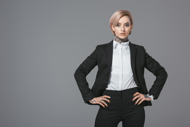 businesswoman posing in formal wear, isolated on grey - Foto, afbeelding