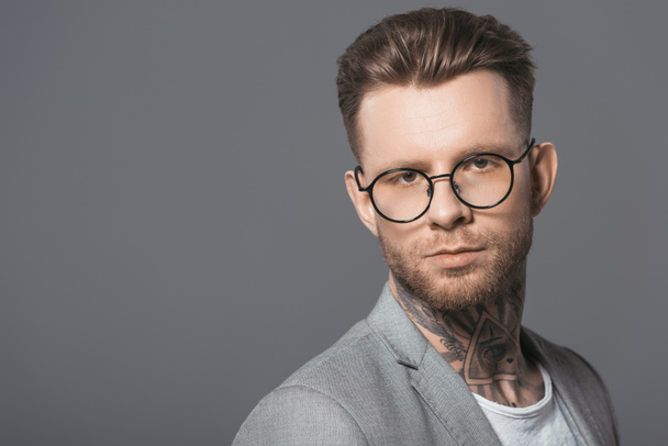 portrait of handsome businessman in trendy eyeglasses, isolated on grey - Photo, image
