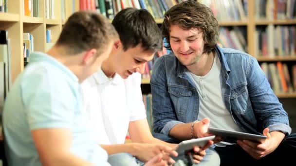 Male classmates researching knowledge on tablet - Footage, Video
