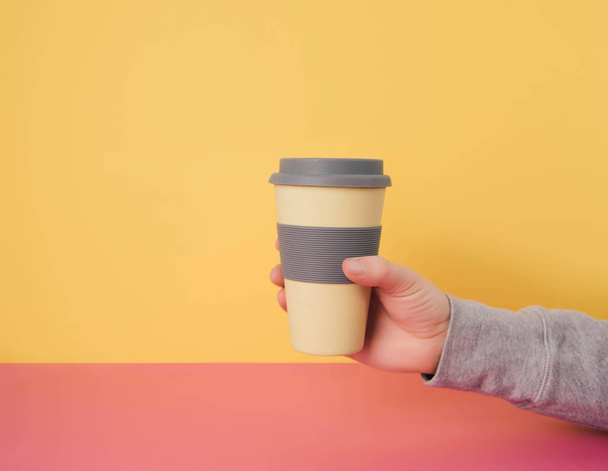 Hand holding take away coffee cup. - Photo, image