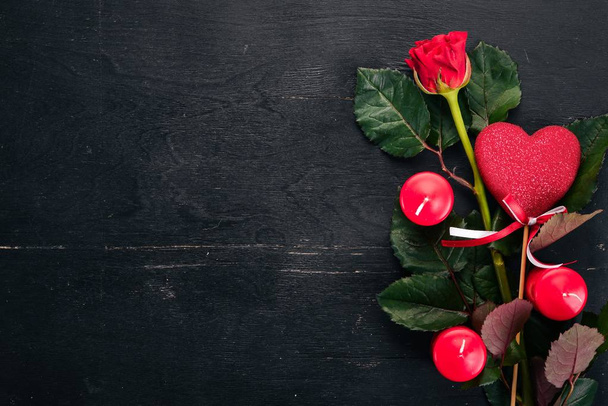 Valentine's Day Banner. Roses and a gift. On a wooden background. Top view. Free space for your text. - Φωτογραφία, εικόνα
