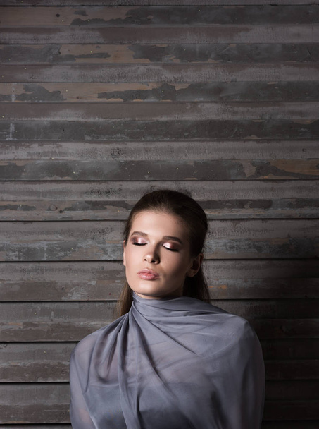 Young woman thinking about something with her eyes closed. Professional makeup - Photo, image