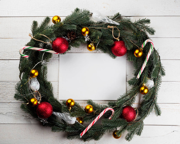 Christmas spruce branch wreath on the wood board - Zdjęcie, obraz