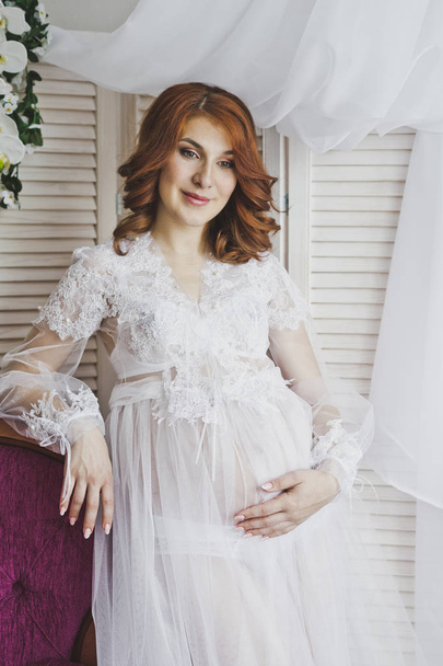 Portrait of a redhead girl in a transparent negligee 6830. - Foto, imagen