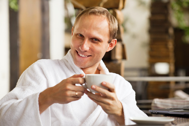 Kindly smiling man portrait with cup of morning coffee - Foto, immagini