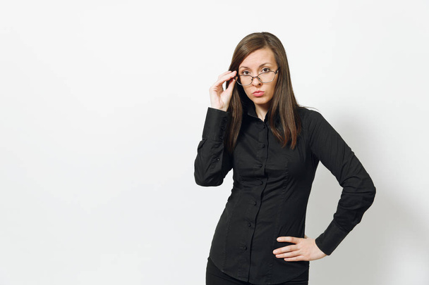Beautiful serious upset caucasian young brown-hair business woman in black classic shirt, skirt, glasses iisolated on white background close up. Manager, worker, student. Copy space for advertisement. - Photo, Image
