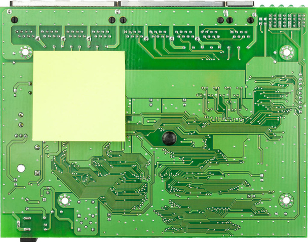 Closeup PCB green board and sticker. Place for your text on the sticker - Foto, Imagem