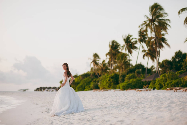 Beautiful bride on the beach of the island - Фото, изображение