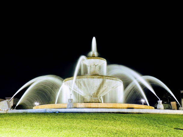 Night vision of a round fountain in Arizona USA. - Photo, Image