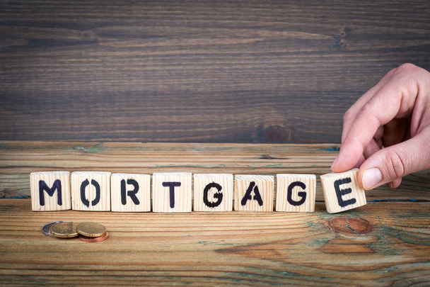 mortgage. Wooden letters on the office desk, informative and communication background - Photo, Image