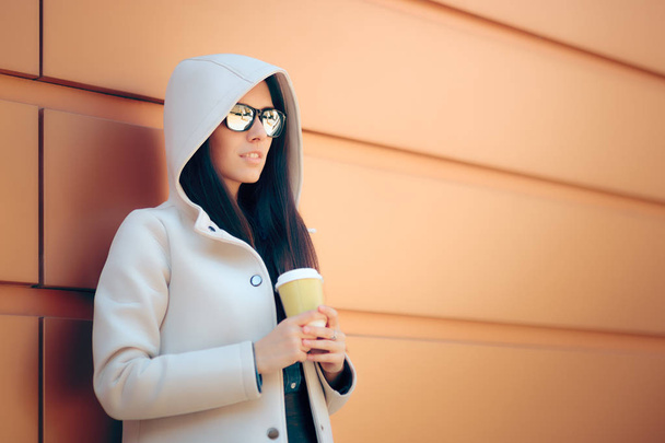 Cool Urban Fashion Girl With Hooded Coat and Coffee - Foto, imagen