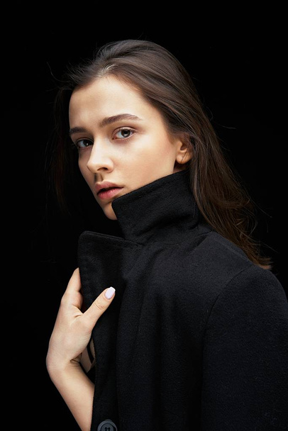Portrait of gorgeous fashion model against dark studio background                           - Foto, Bild